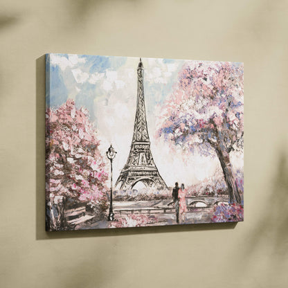A canvas painting wall art of the eiffel tower surrounded by pink cherry blossoms and a couple walking in pastel tones