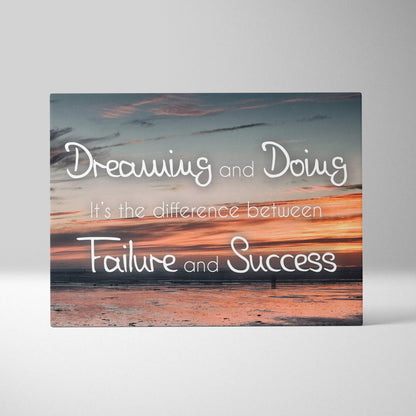 Motivational beach sunset canvas wall art with orange blue coastal photo and inspirational dreaming and doing quote in white cursive