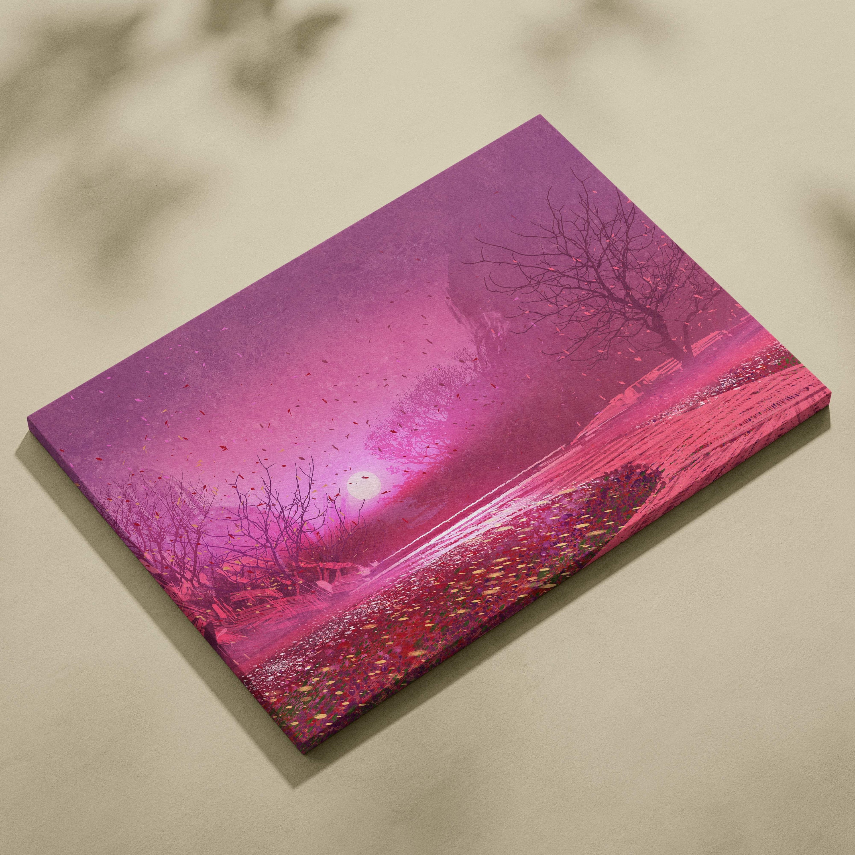 A vibrant pink canvas print of a surreal landscape with bare trees falling petals and a glowing sun against a gradient sky
