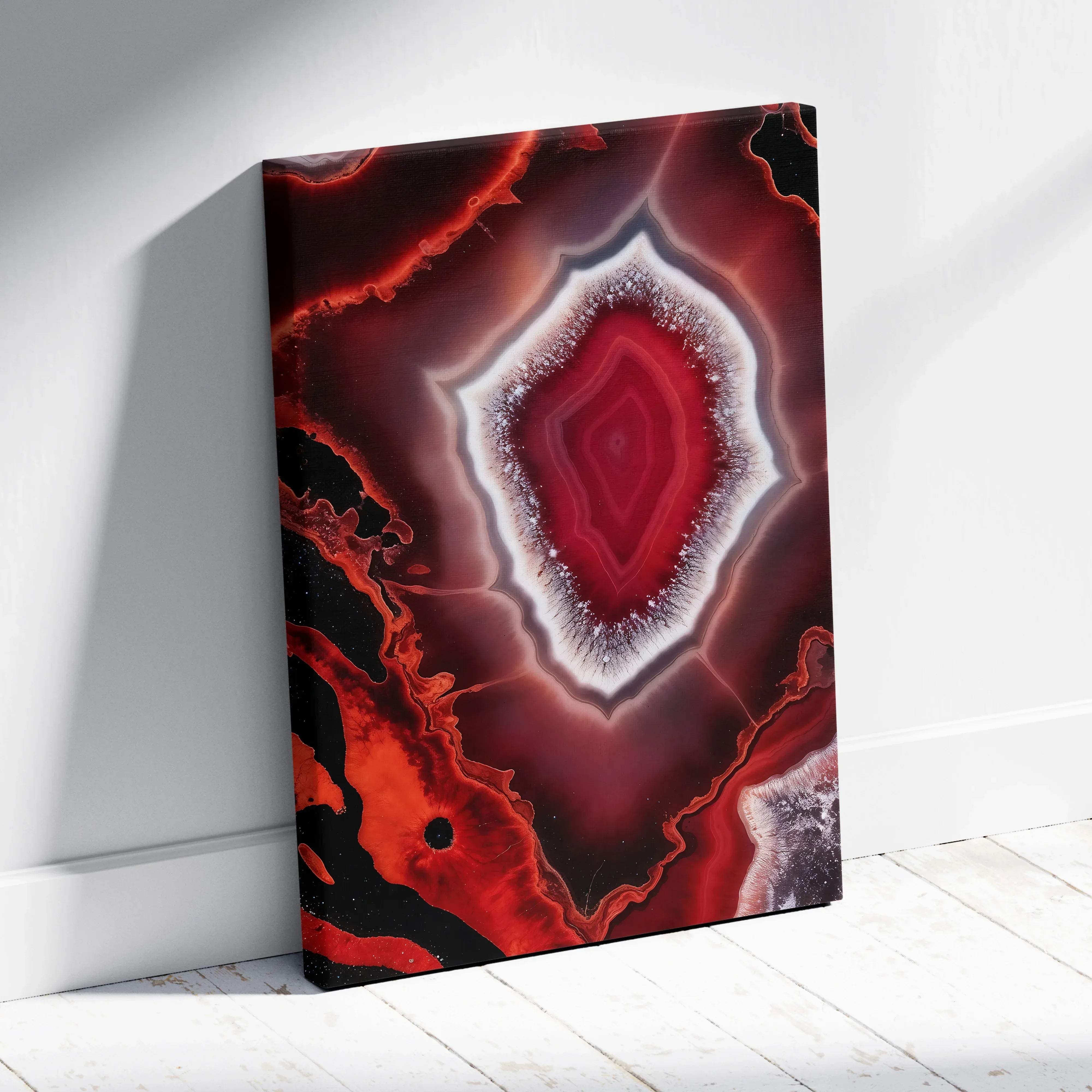 Vibrant red and black agate canvas wall art featuring a striking central geometric pattern with white fringes for drama