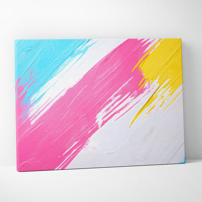 A vibrant abstract canvas wall art print with bold pink yellow and cyan diagonal brushstrokes on white textured background