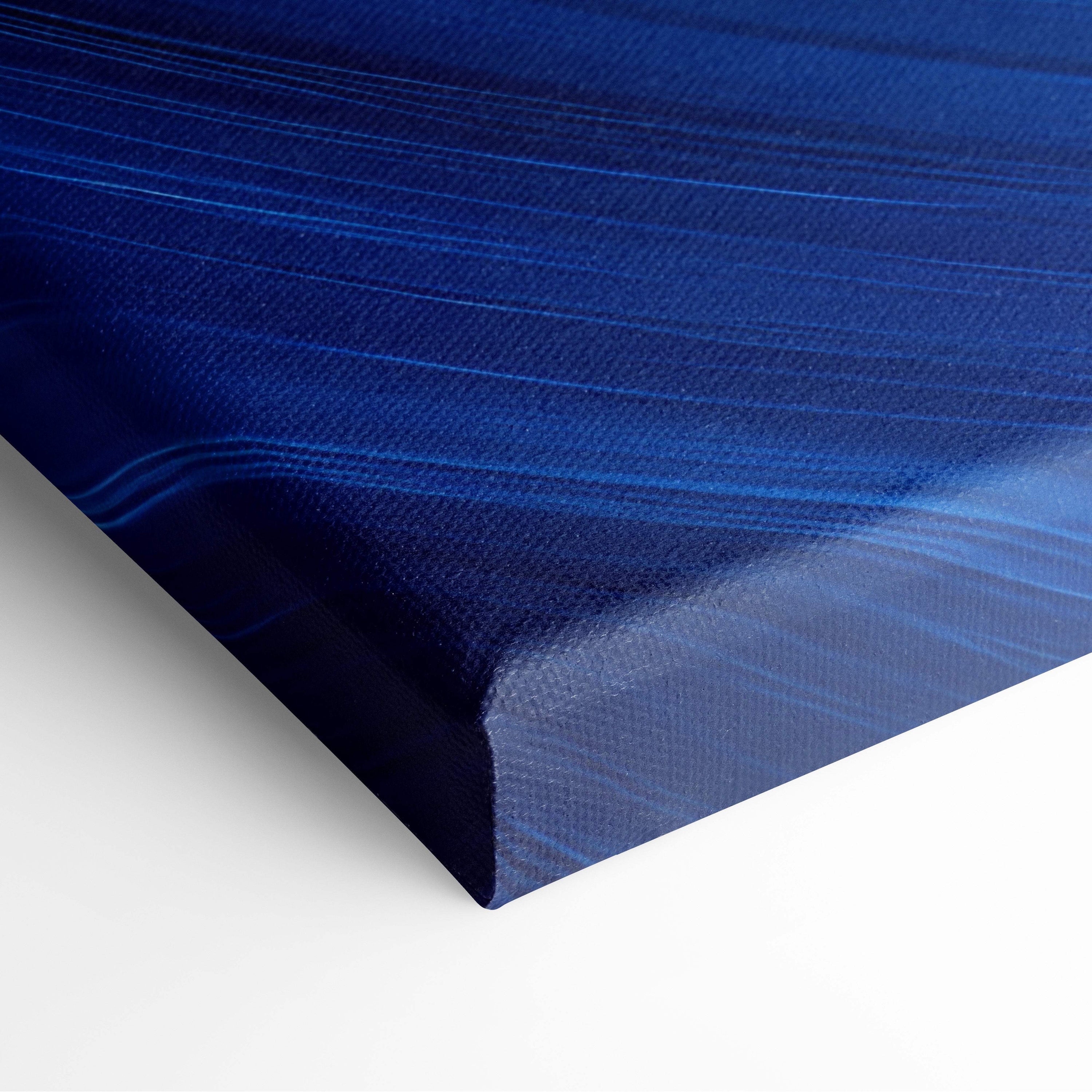 Deep blue abstract swirl canvas wall art print with textured brushstroke patterns for modern living room or coastal decor