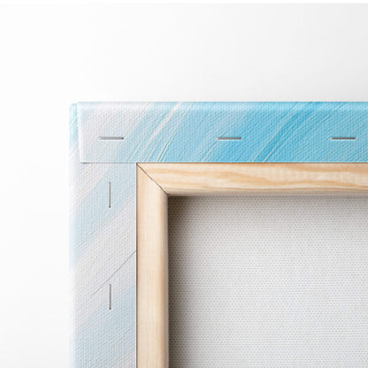 Blue abstract swirl canvas wall art print with light blue gradient and natural wood frame for modern coastal decor