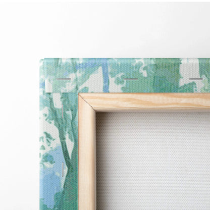 Dreamy watercolor forest landscape canvas wall art in greens and blues on light wood frame