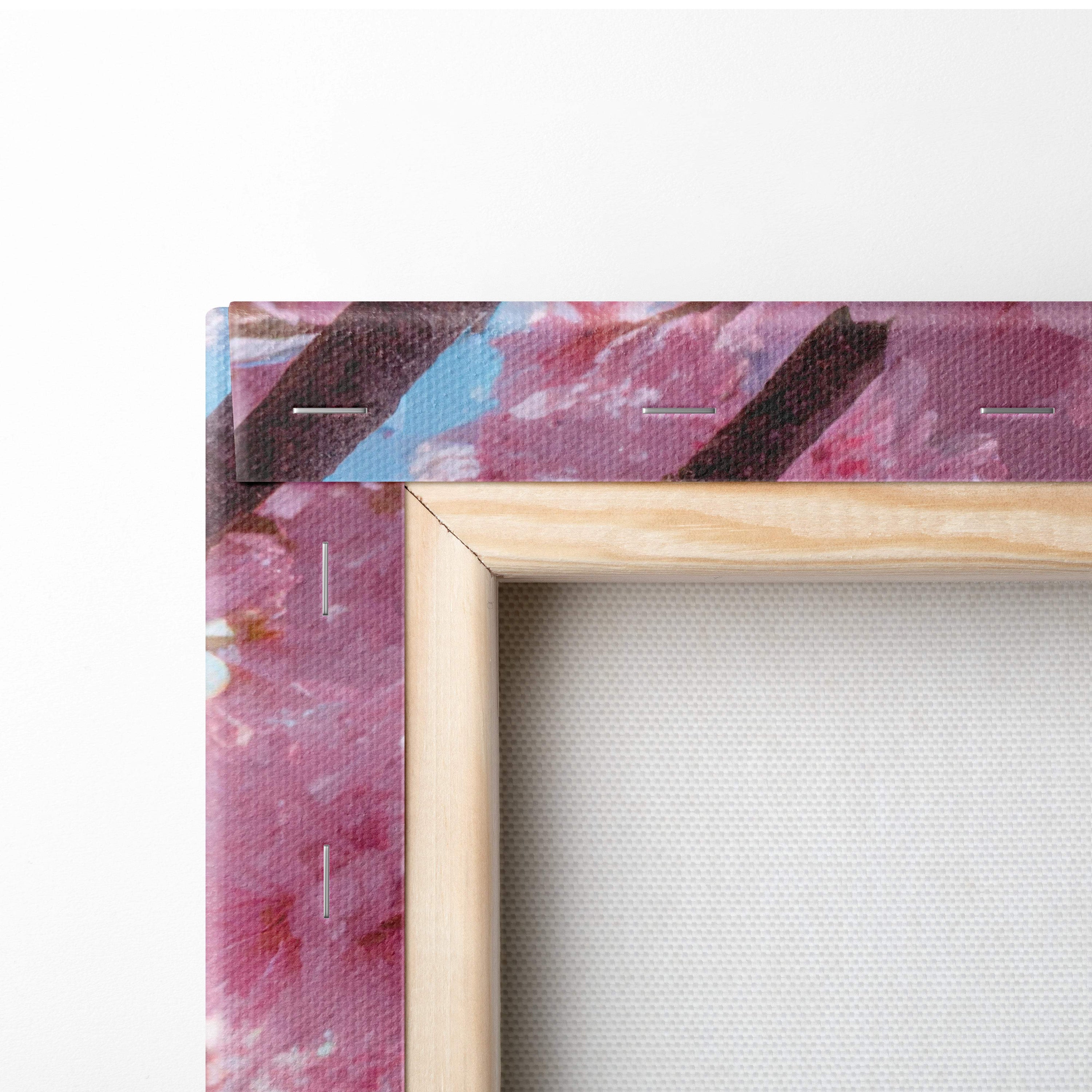 A wooden frame pink cherry blossom sky canvas wall art with vibrant swirling pink purple and blue brushstrokes