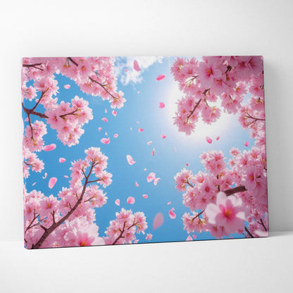 Rectangular canvas wall art featuring vibrant pink cherry blossoms and falling petals against a bright blue spring sky