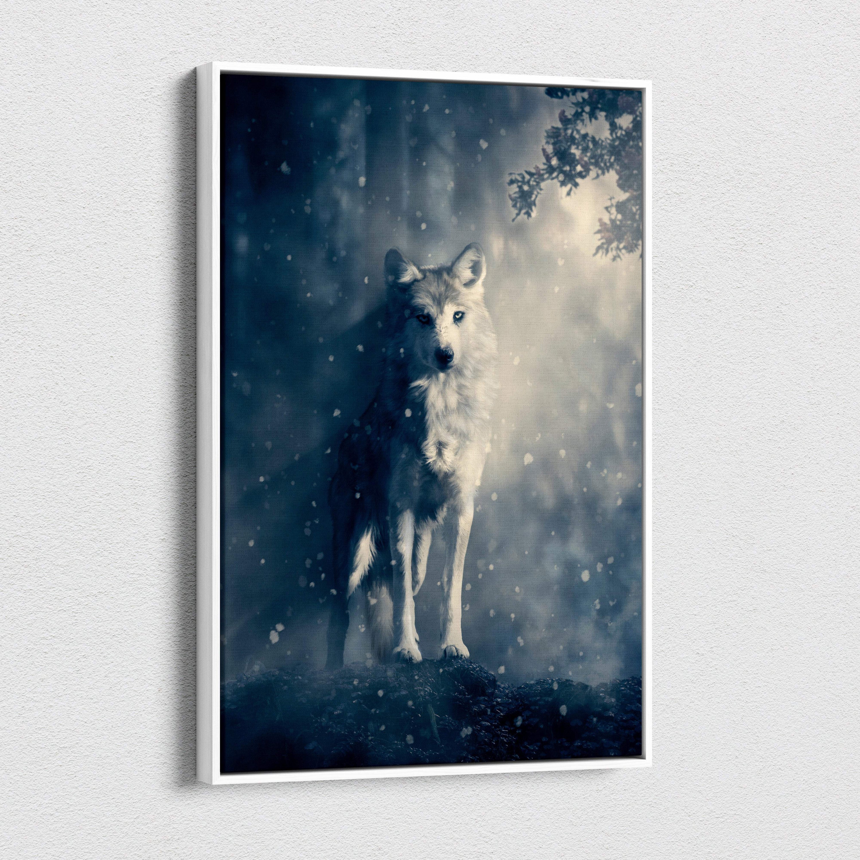 A framed canvas print of a majestic white wolf in a snowy blue gray misty forest for rustic cabin decor