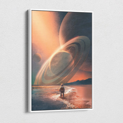 A framed canvas print of a lone astronaut on a beach with orange sky and giant ringed planets cosmic horizon explorer wall art