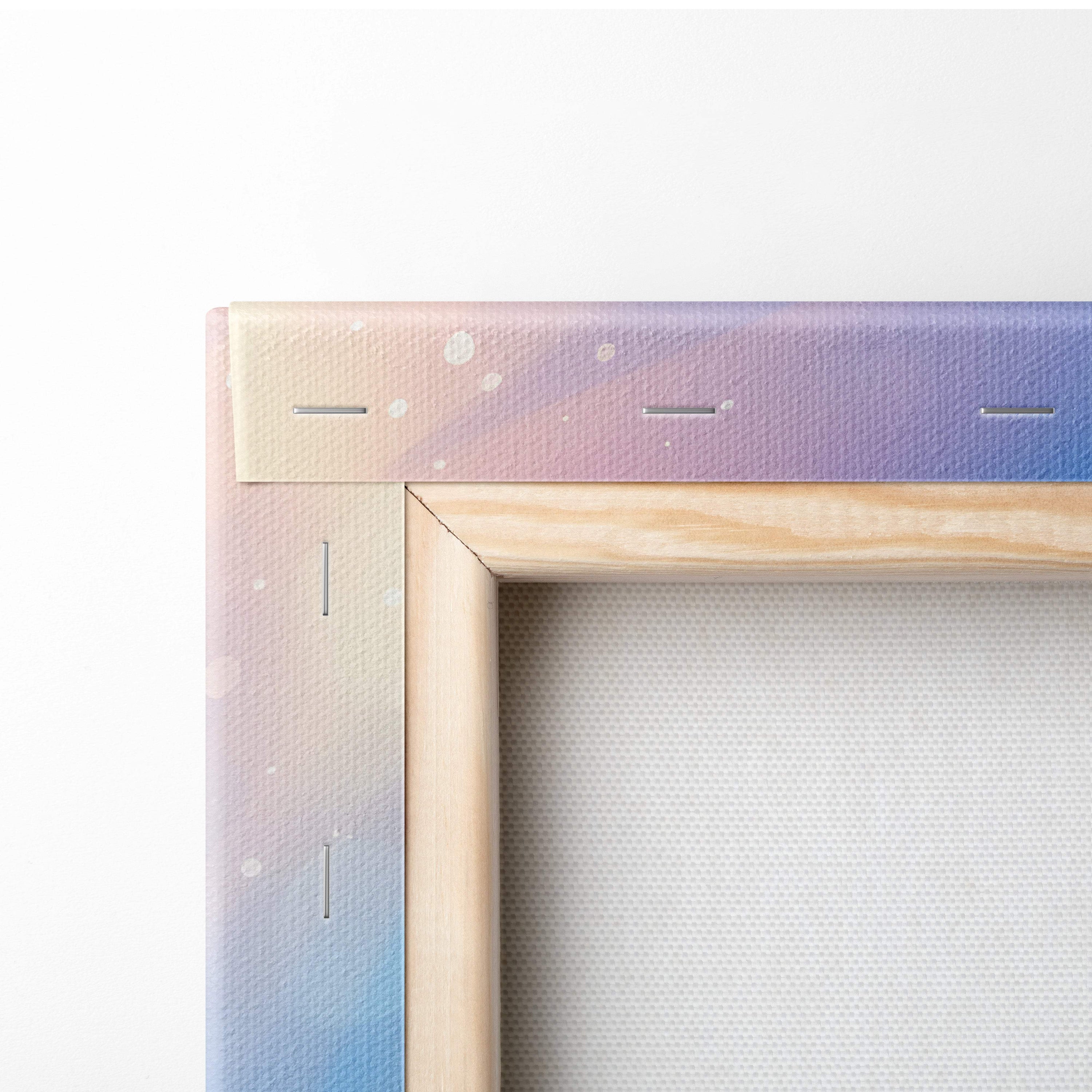 Wooden canvas frame with pastel pink to lavender and blue gradient and white speckles for coastal living room decor
