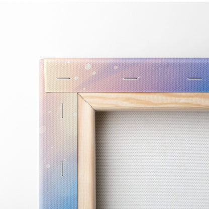 Wooden canvas frame with pastel pink to lavender and blue gradient and white speckles for coastal living room decor