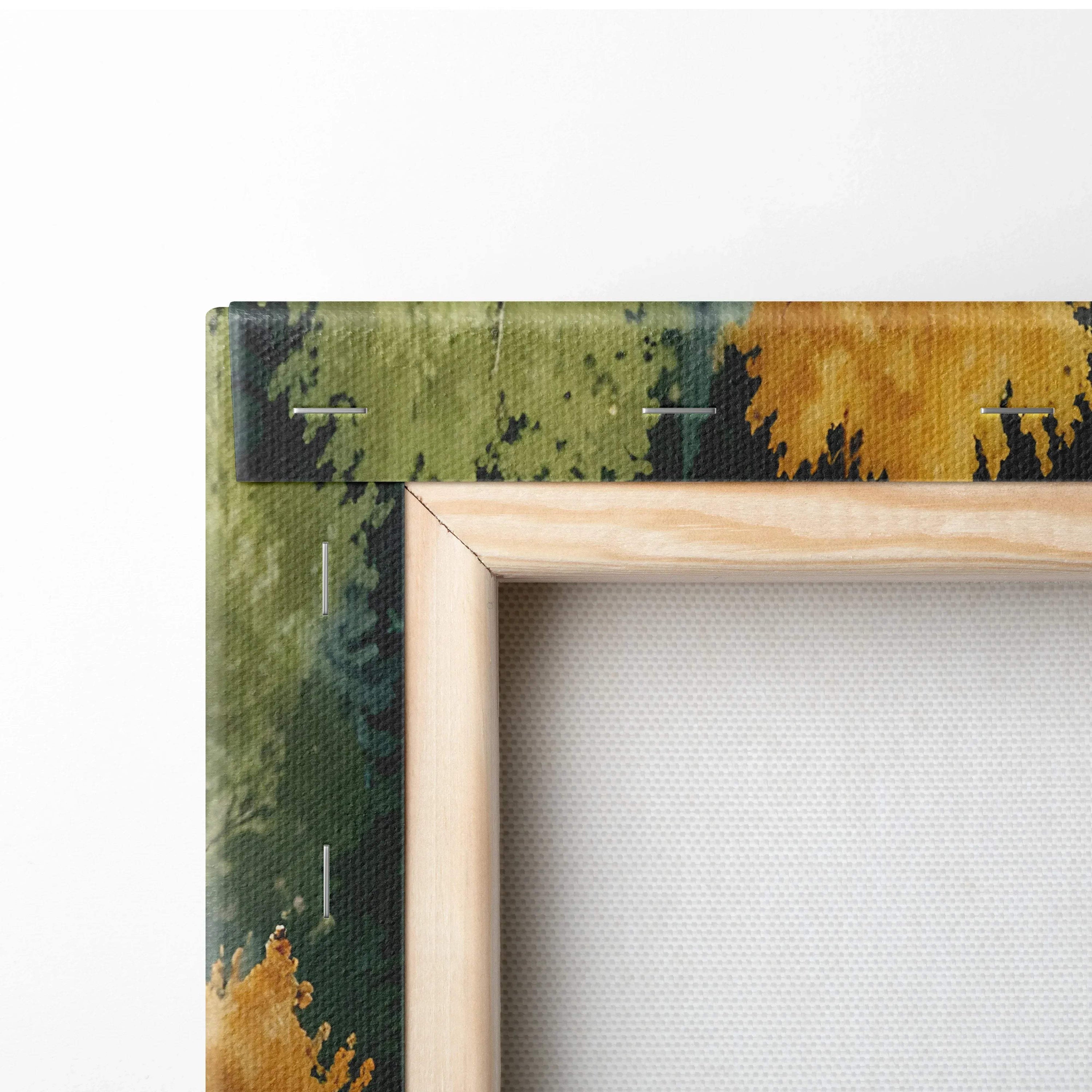 Close-up of autumn forest watercolor canvas wall art with green and orange tones and natural wood frame.