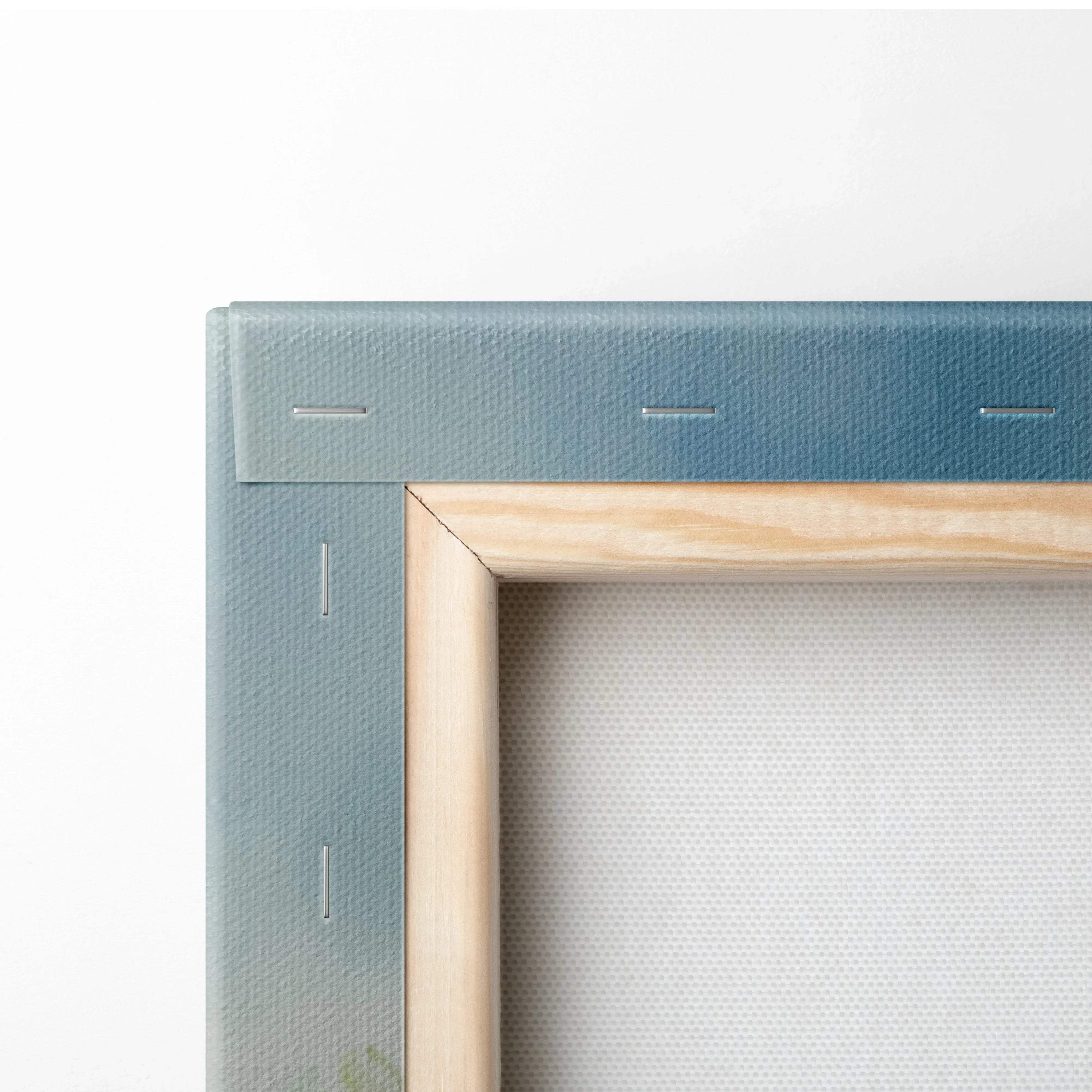 Close-up of watercolor floral canvas wall art with wooden frame and stapled corners.