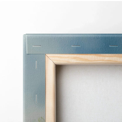 Close-up of watercolor floral canvas wall art with wooden frame and stapled corners.