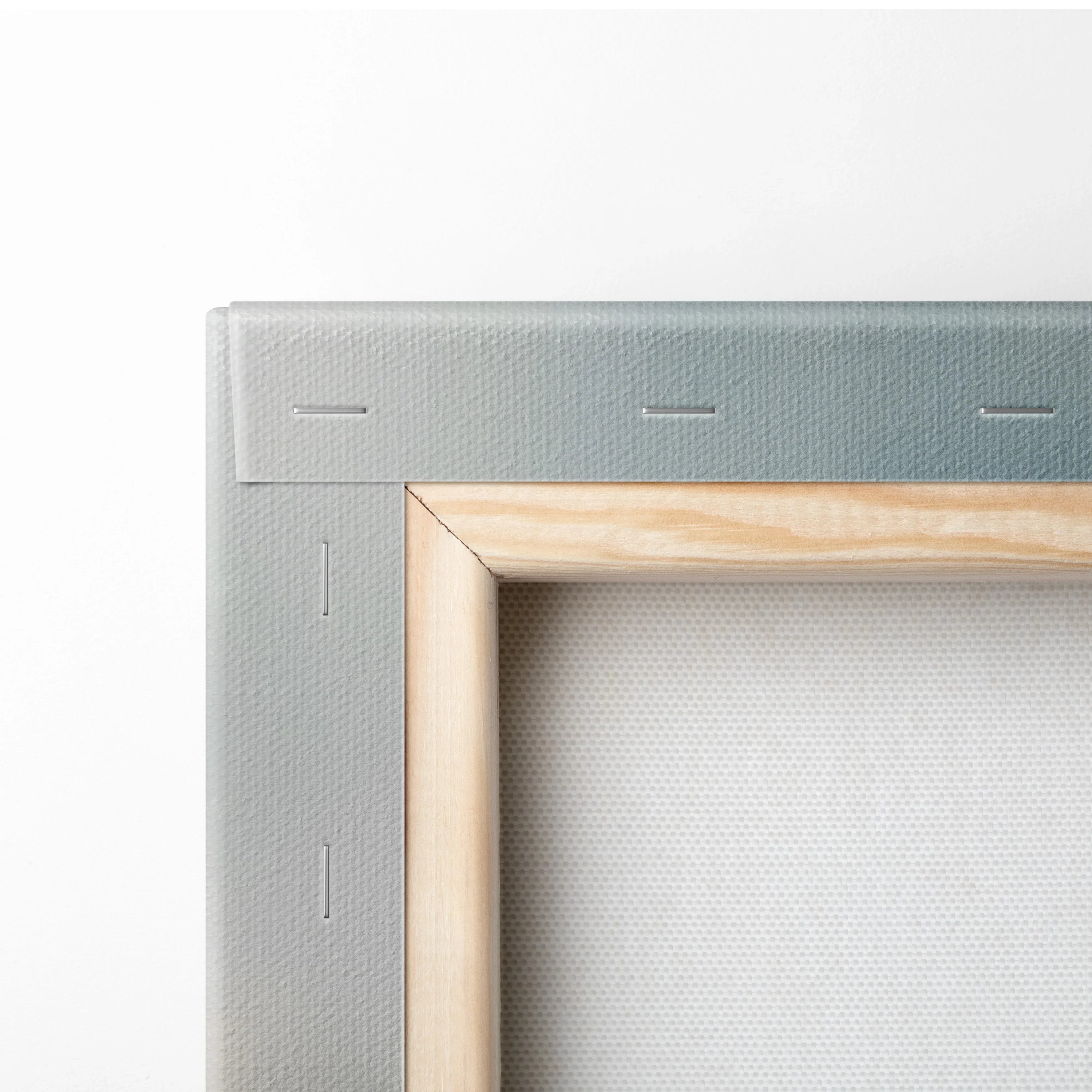 Close-up of wooden stretcher frame and canvas texture on watercolor wall art.