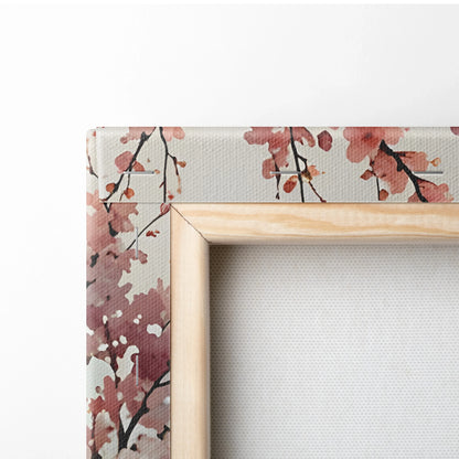 Cherry blossom watercolor art on wrapped canvas with natural wood frame edge close-up.