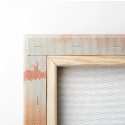 Close-up of canvas stretched on wooden frame with sunset watercolor tones on wall art print.