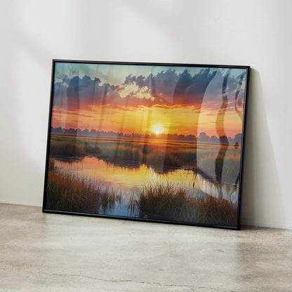 Vibrant watercolor sunset poster with rich orange, pink, and blue sky reflected on calm water, framed wall art.