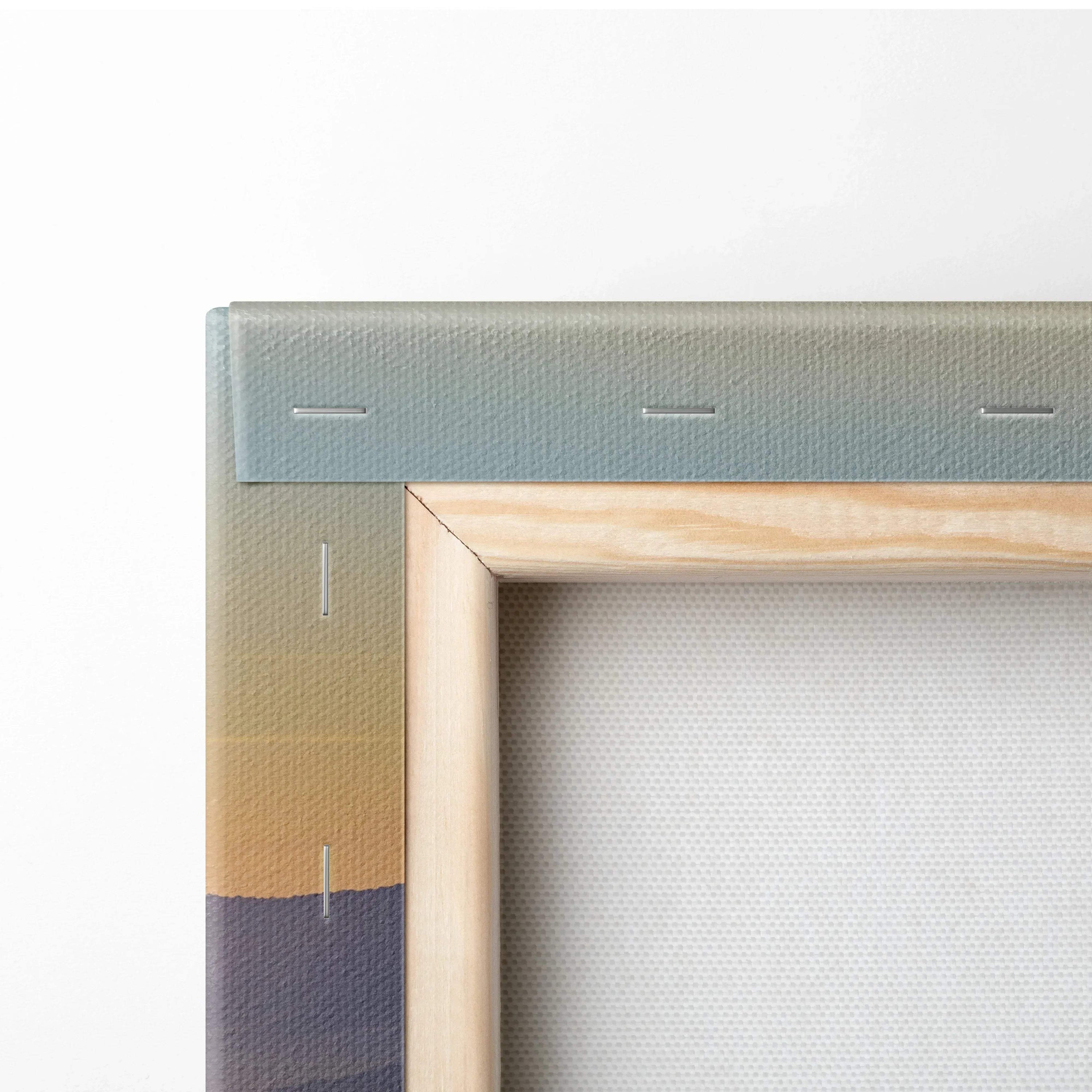Close-up of sunset landscape canvas wall art corner with vibrant watercolor hues and wooden frame.