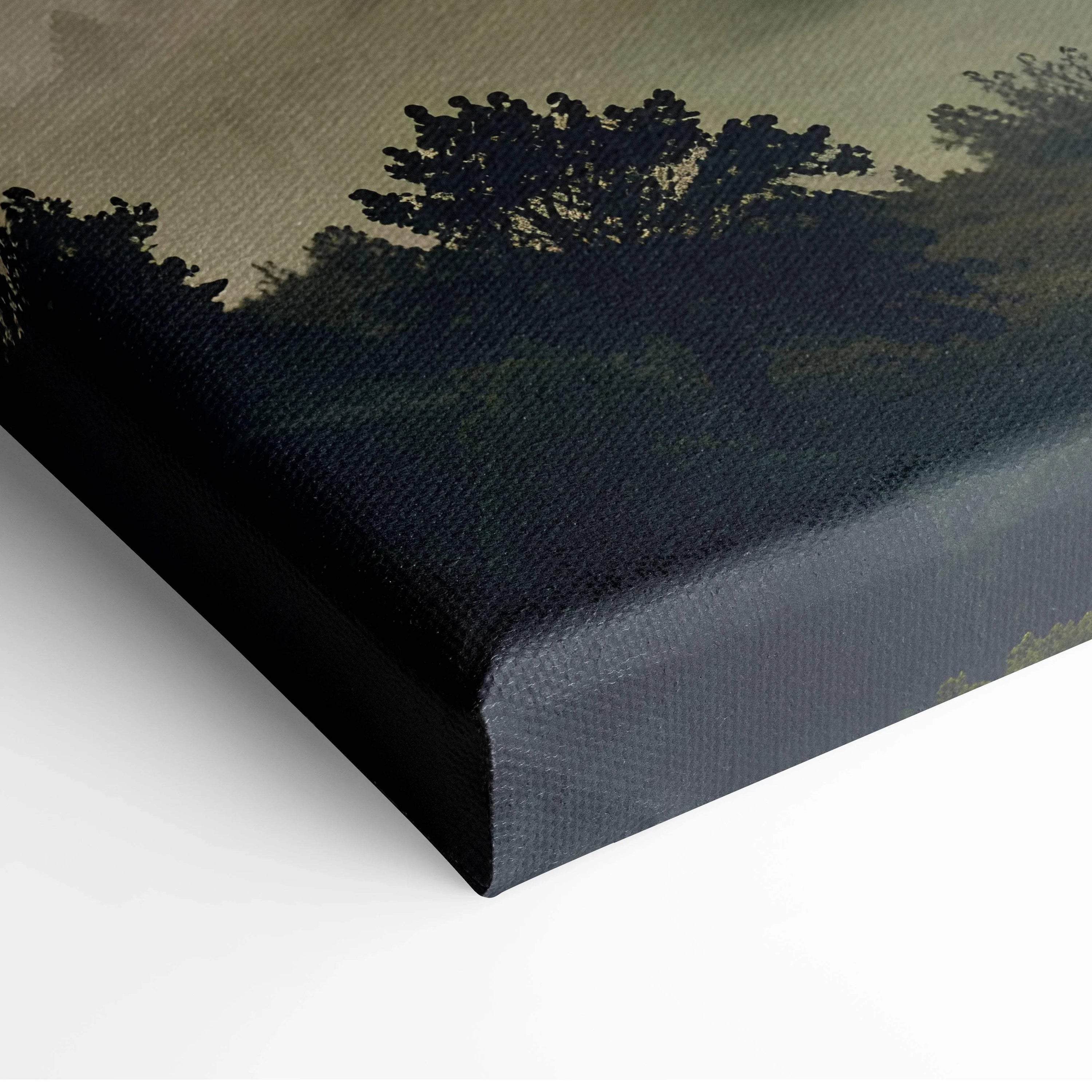 Canvas wall art featuring a dark silhouette of trees against a deep sunset sky with rich, blended colors.