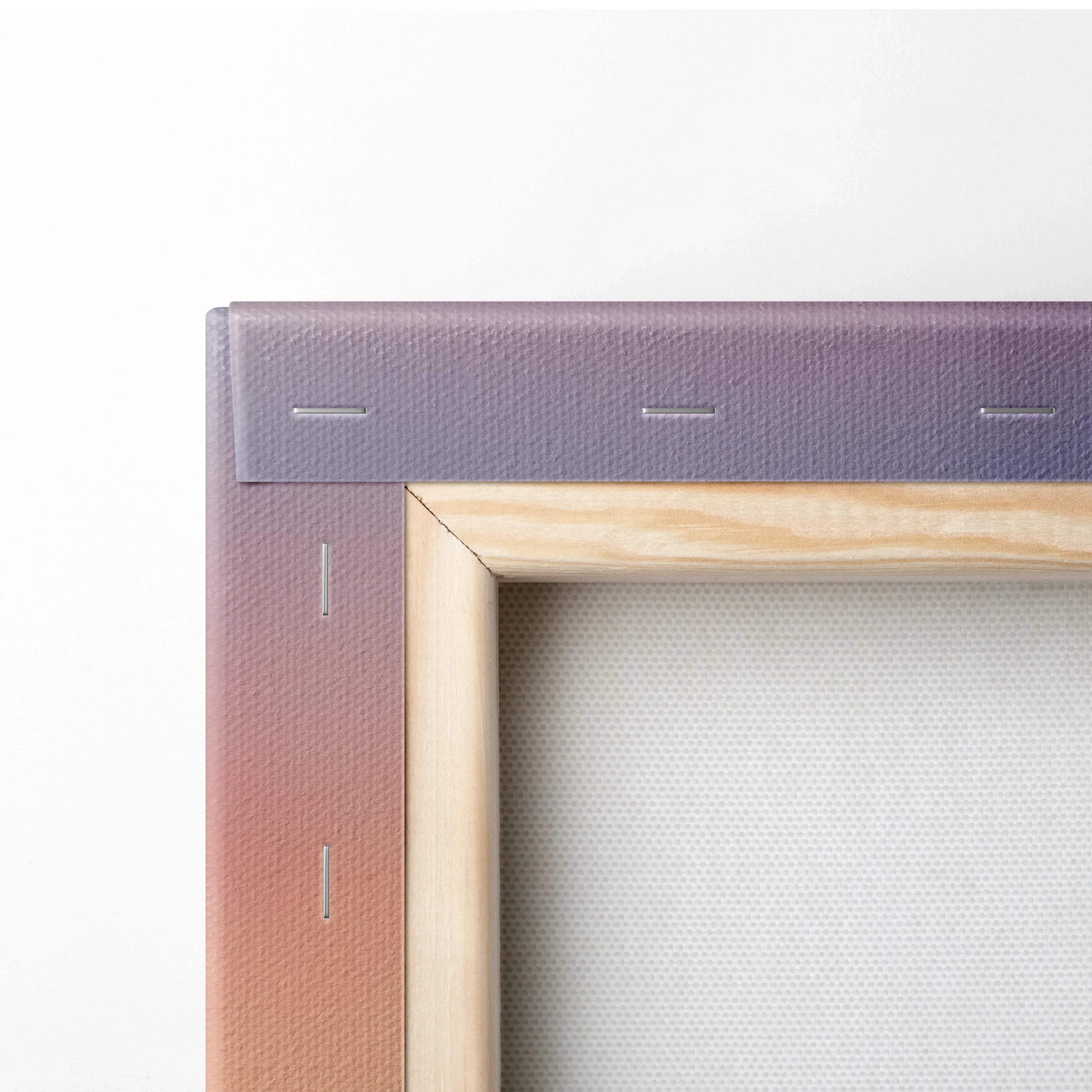 Corner detail of stretched canvas wall art with wooden frame and sunset mountain watercolor design.