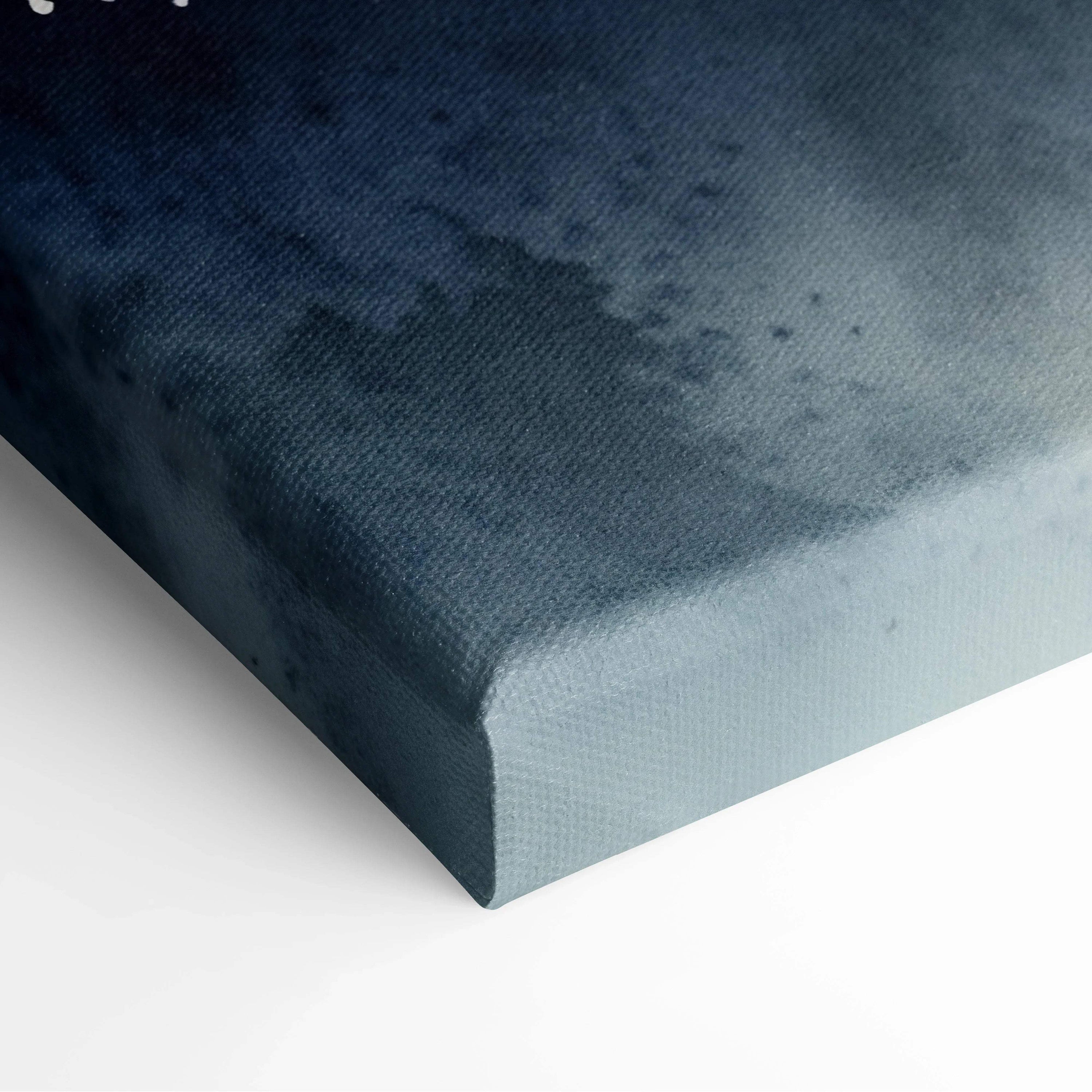 Canvas wall art corner showing dark blue and gray watercolor texture on stretched canvas edge.