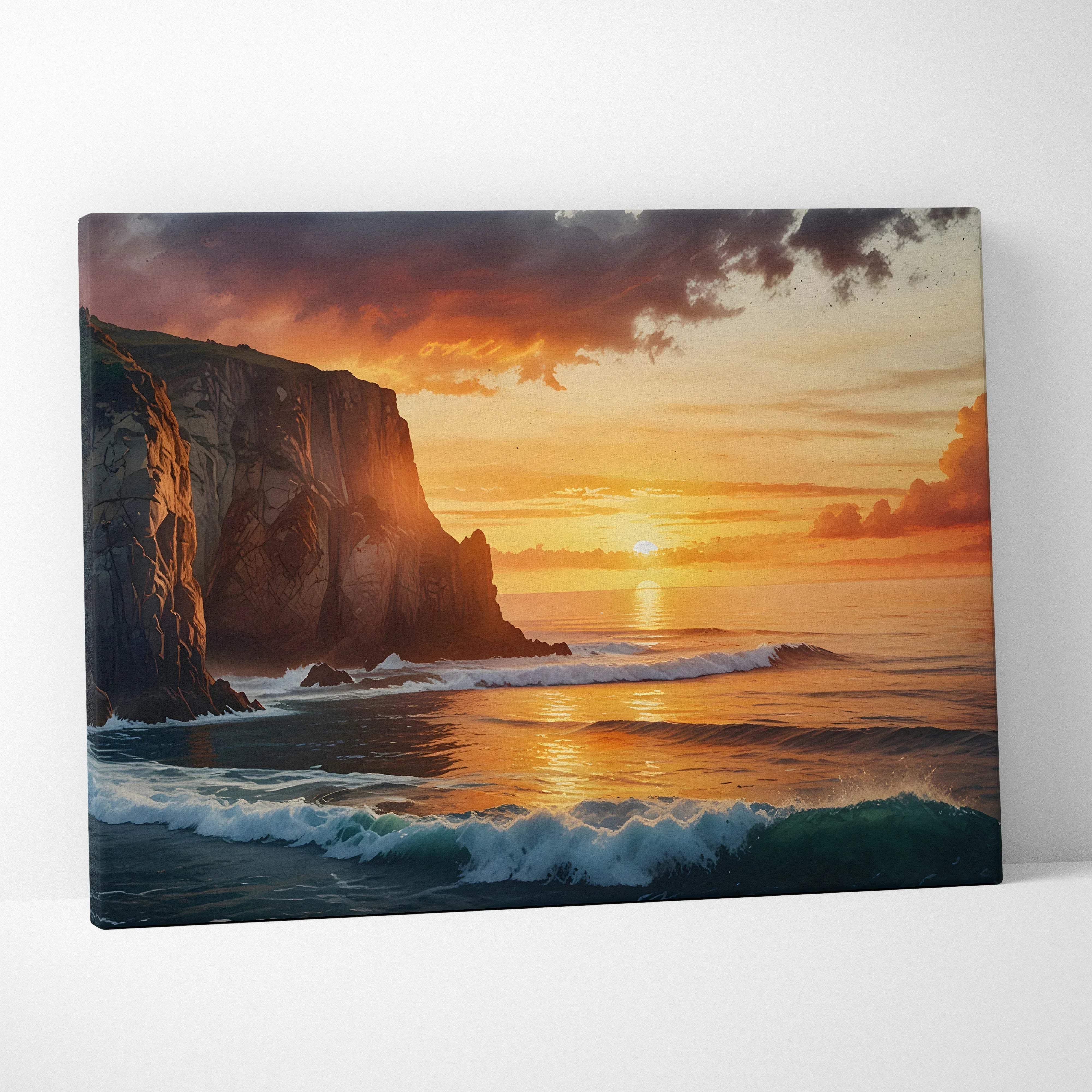 Rectangular canvas wall art showing a dramatic coastal sunset with warm orange and gold hues over rugged cliffs