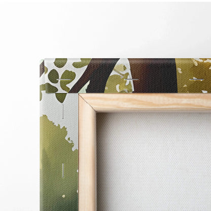 Close-up of vibrant sunset forest watercolor canvas wall art showing wooden frame and corner detail.
