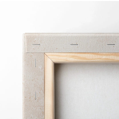 Close-up of wooden frame corner and stapled edge on canvas wall art print.