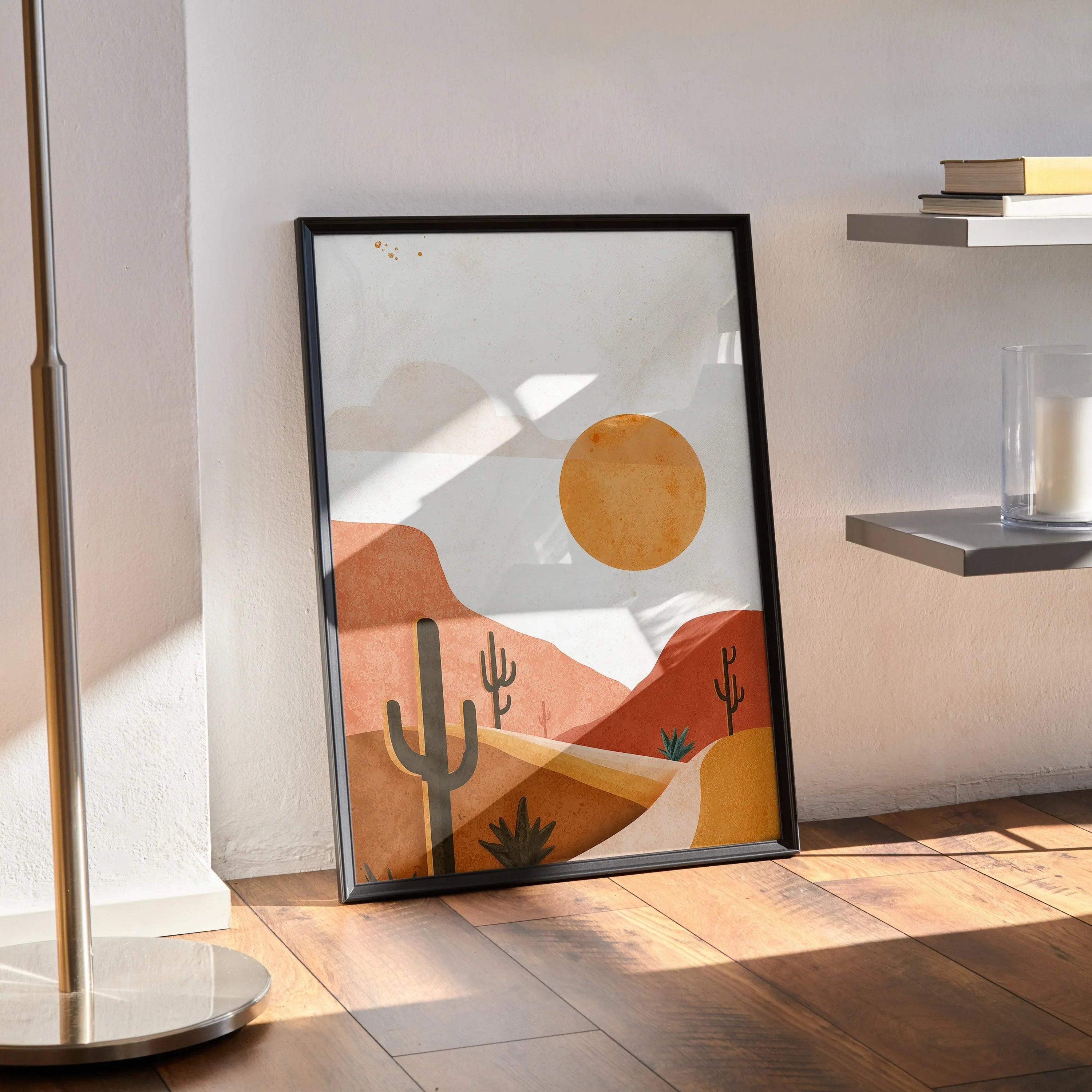 Desert cactus digital art poster with orange sun and abstract hills wall art in black frame.