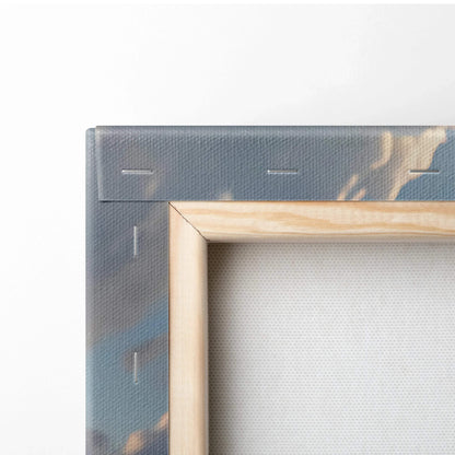 Close-up of colorful canvas wall art corner with visible wooden frame and stretched fabric texture.