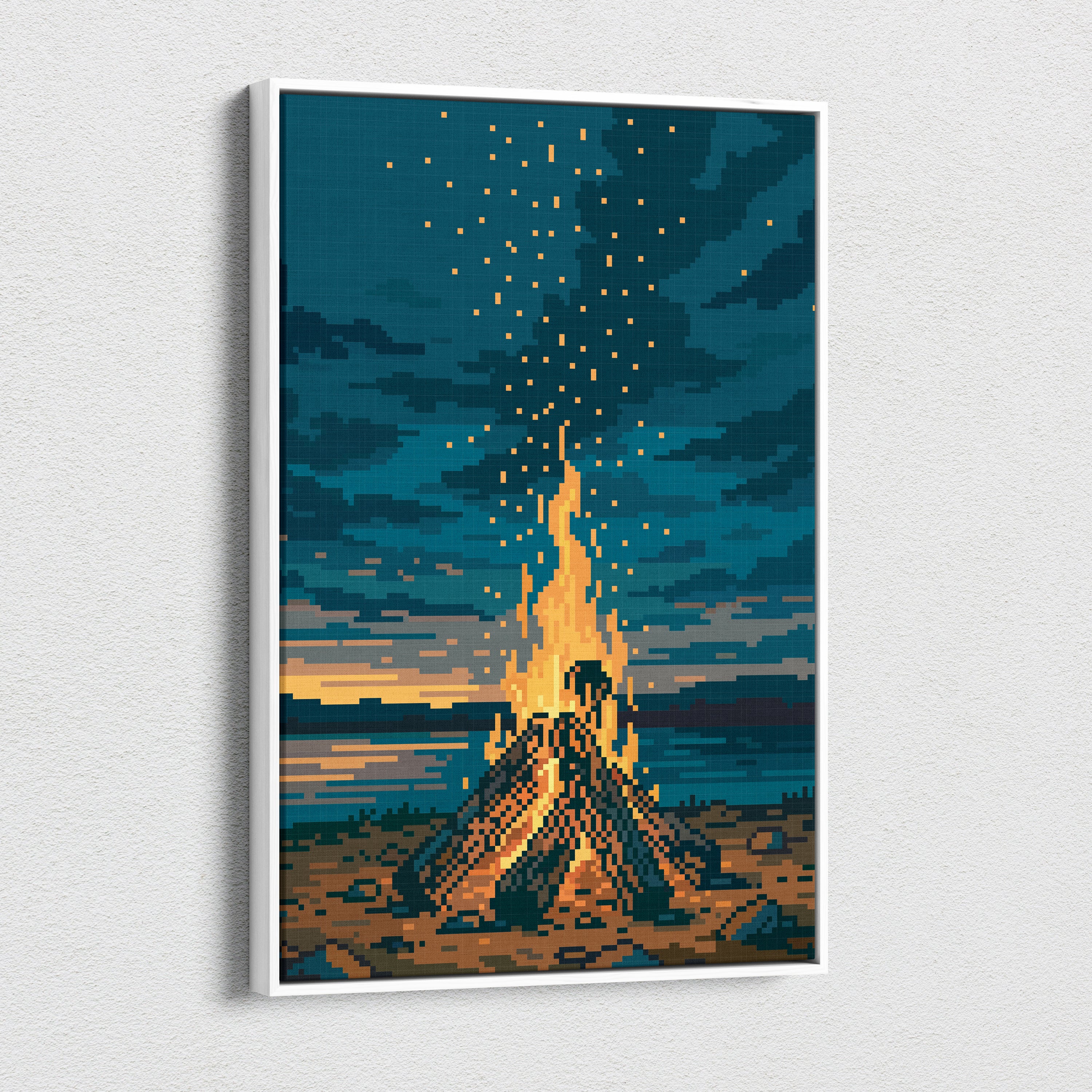 A framed pixel art canvas print of a glowing orange campfire under a blue starry night sky for cozy camping decor