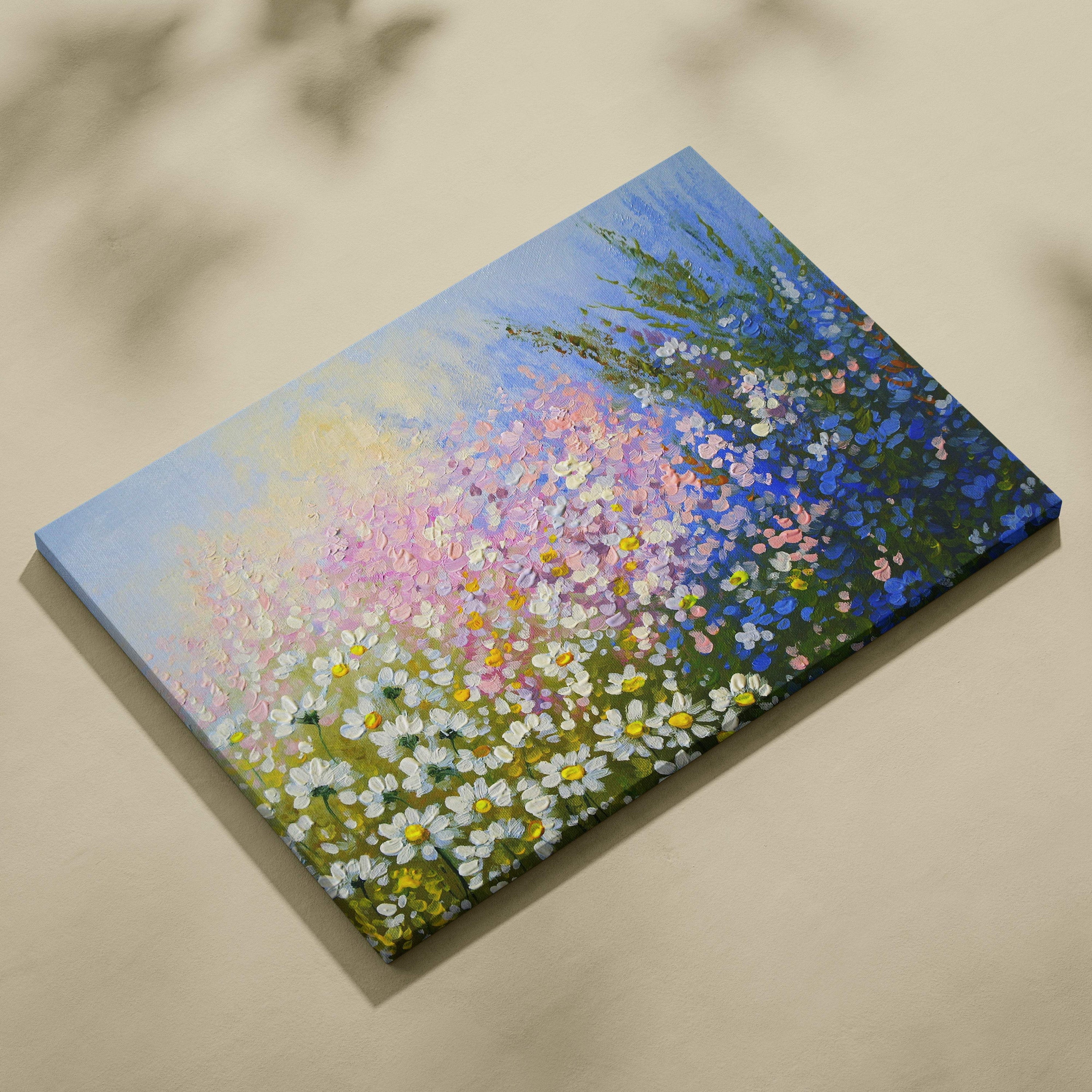A vibrant wildflower meadow painting canvas print featuring soft pastel daisies blue and pink floral landscape