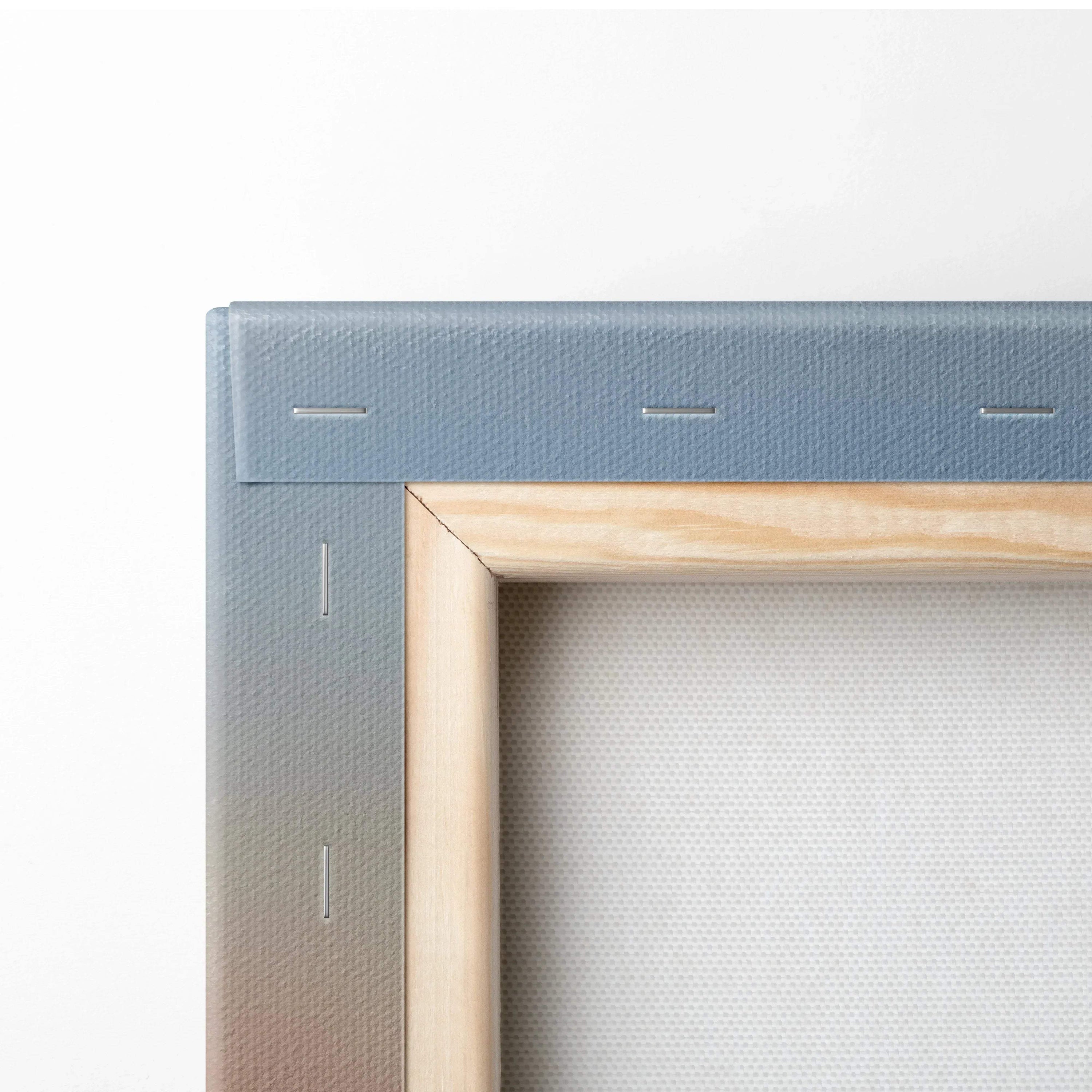 Close-up of wooden frame and stapled canvas backing for wall art painting.