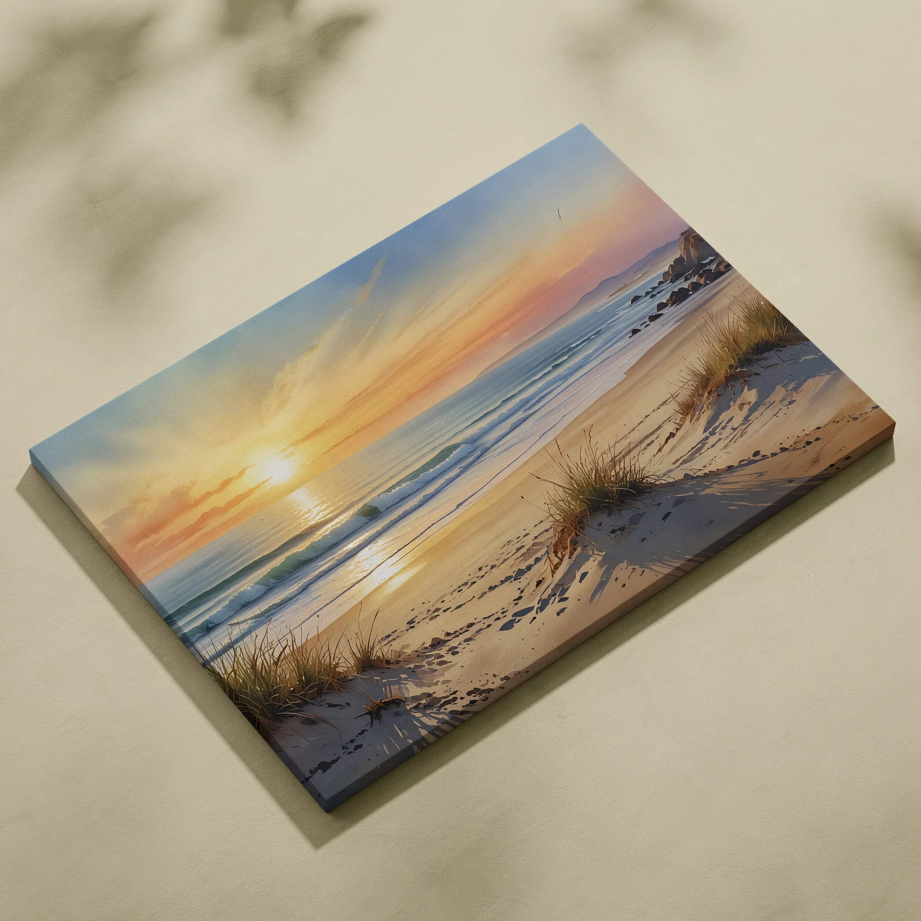 Canvas wall art featuring a vibrant watercolor sunset over a sandy beach with waves and dune grass.