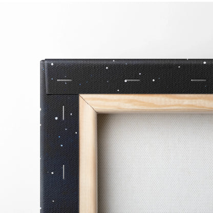 Close-up of black starry night sky canvas edge with wooden frame, textured wall art surface.