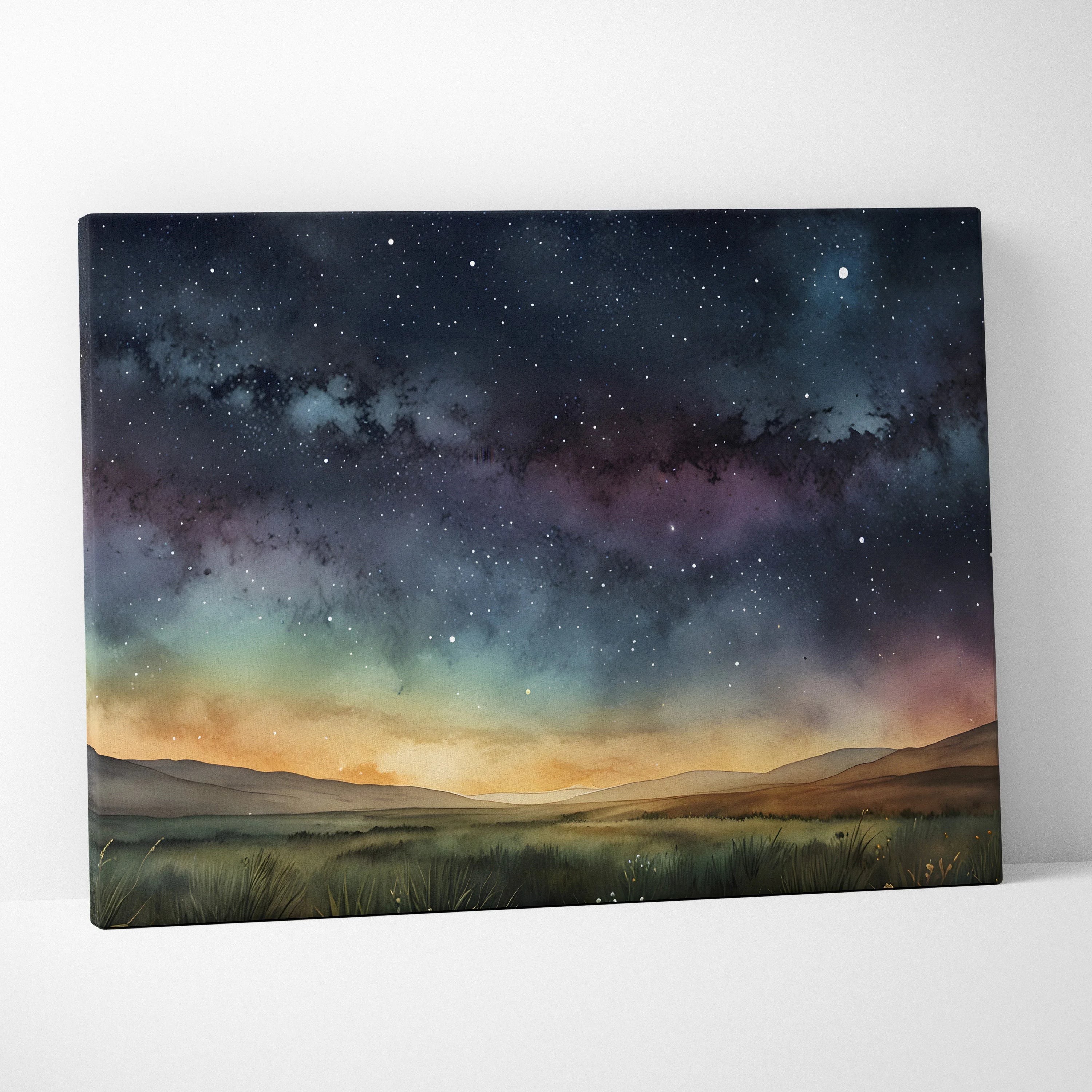 Watercolor canvas wall art depicting a starry night sky over rolling hills in soft blues, purples, and warm sunset tones.