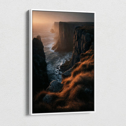Vertical canvas wall art featuring a dramatic nature sunset over rugged cliffs with golden light on grassy foreground.