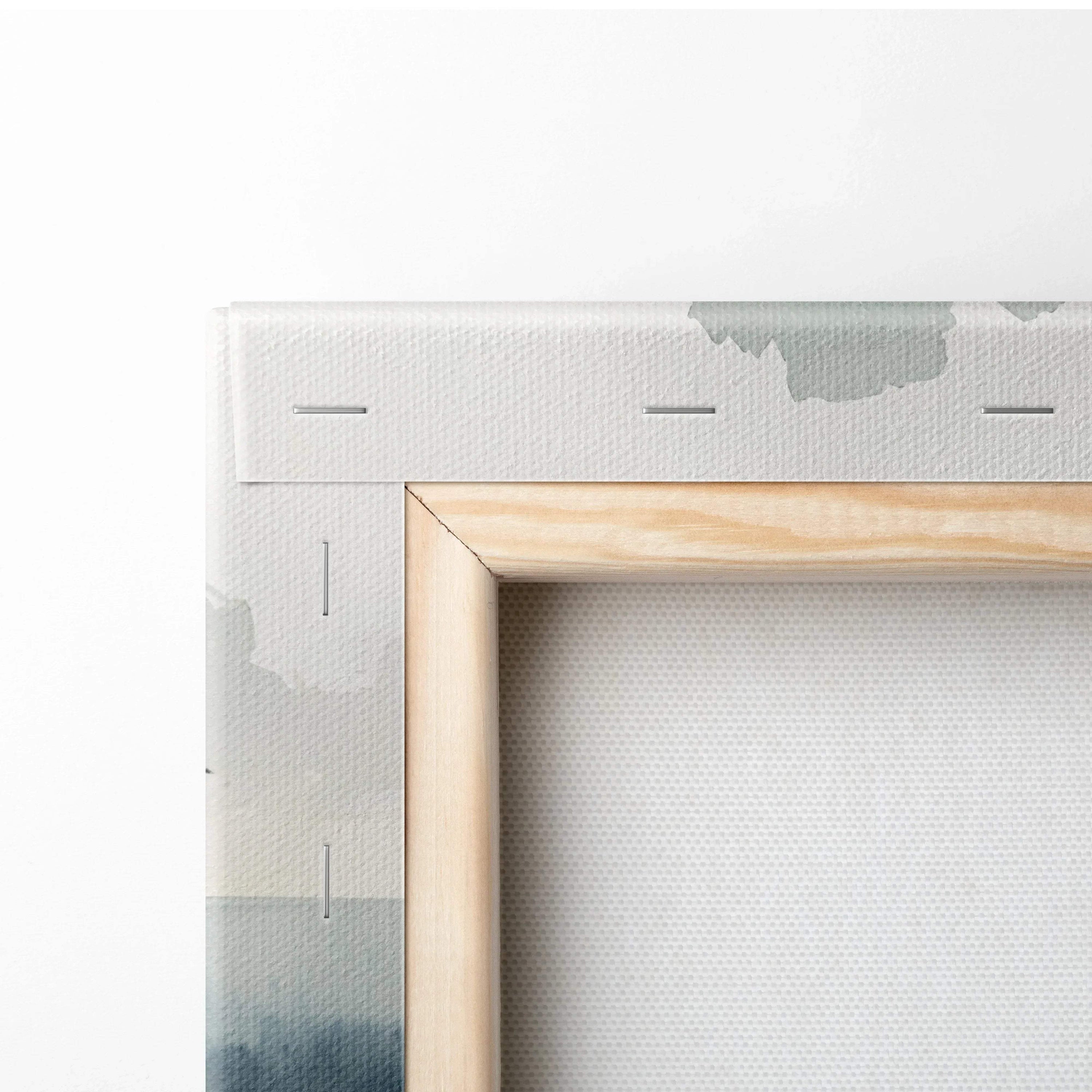 Close-up of wooden frame and white canvas backing of watercolor lighthouse ocean wall art.