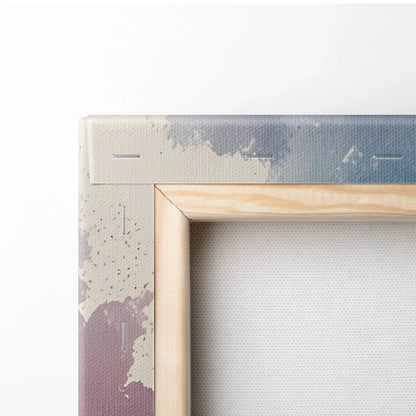Close-up of wooden stretcher frame and textured canvas edge with watercolor sunset tones for wall art.