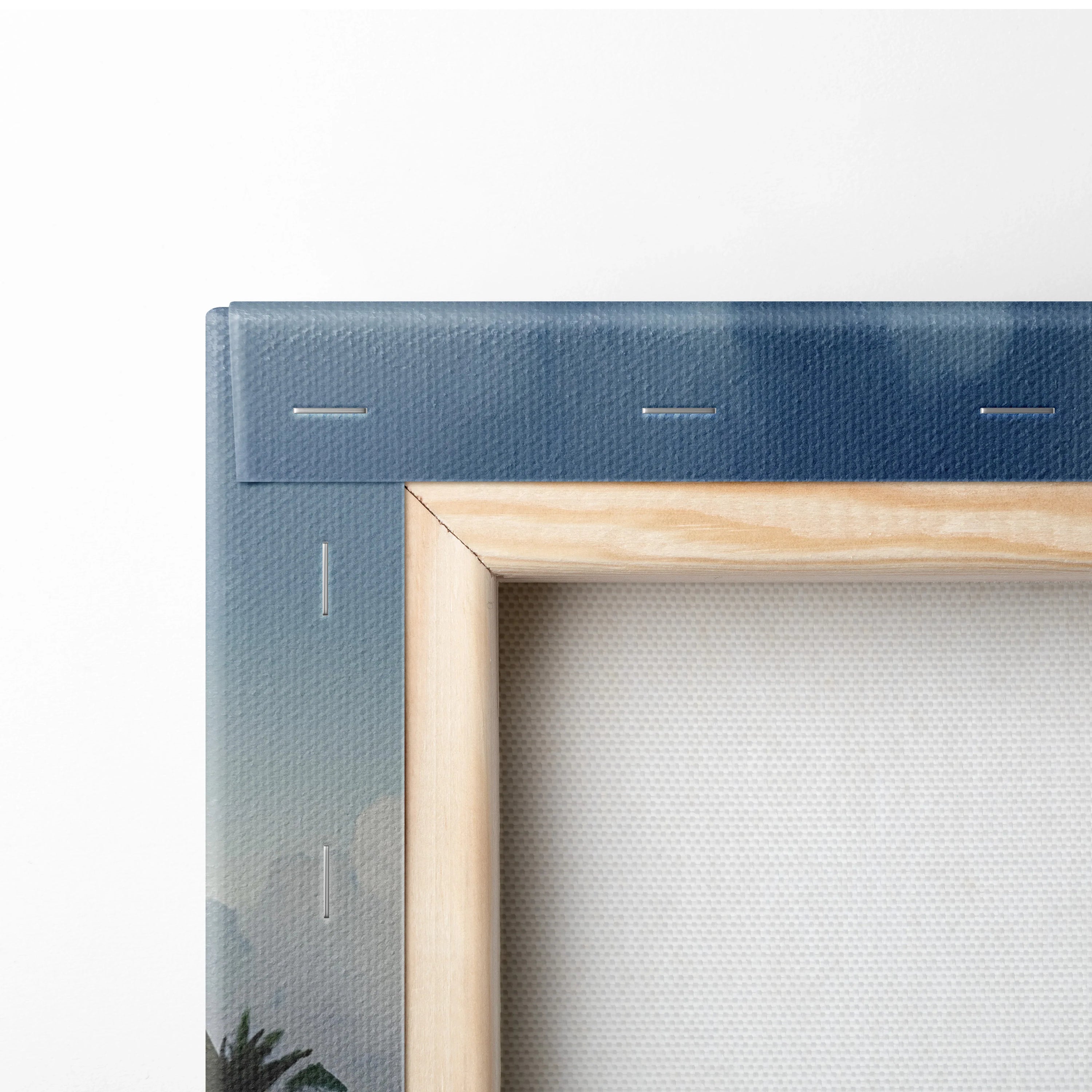 Close-up of wooden frame corner on watercolor beach canvas wall art with visible canvas texture and stapled edges.