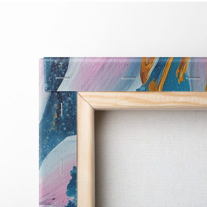 A wooden frame holding a pink blue lily canvas wall art with gold abstract floral design for modern decor