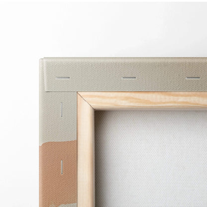 Close-up of wooden frame and beige fabric canvas for stretched wall art.