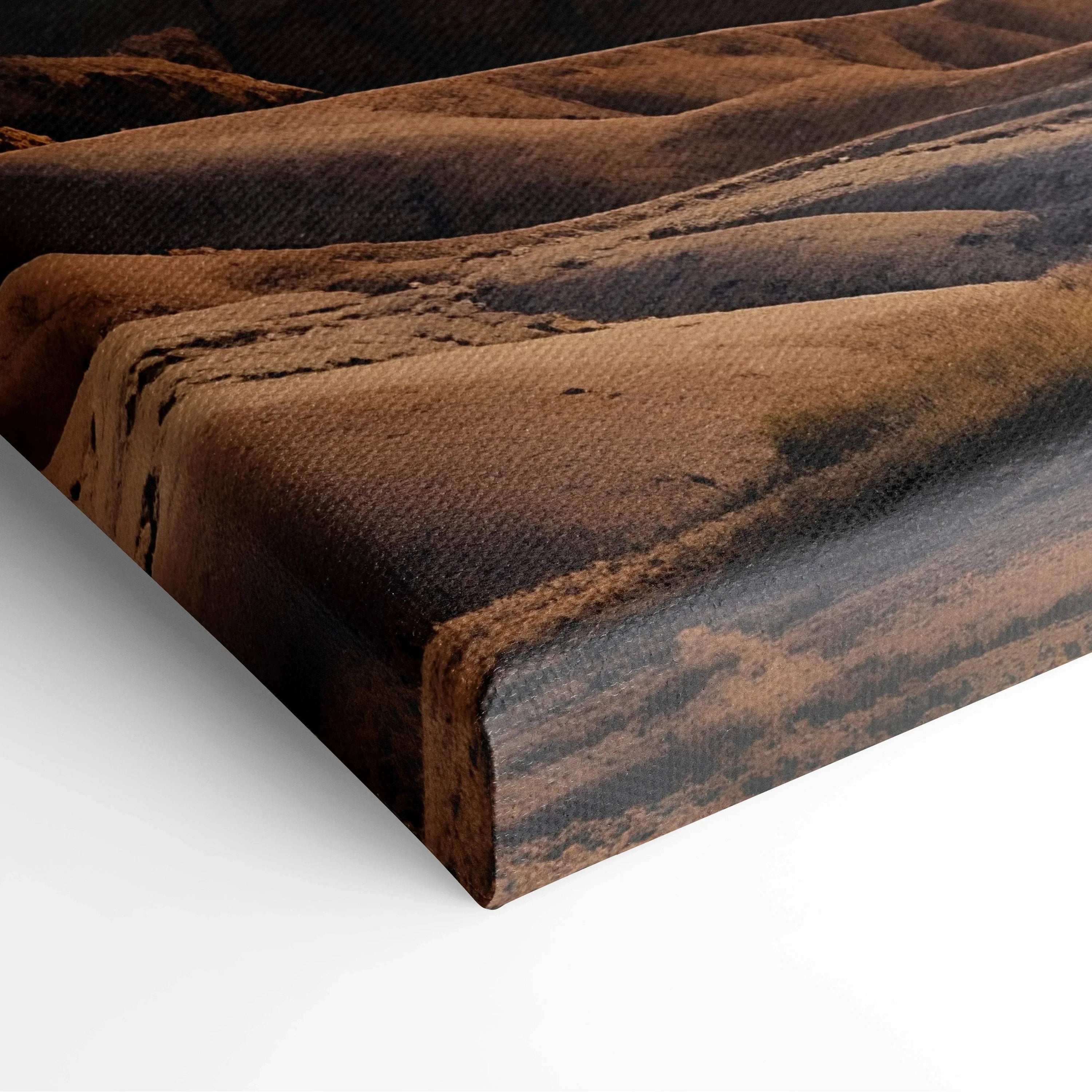Close-up of textured canvas wall art featuring warm-toned mountain sunset digital art print.