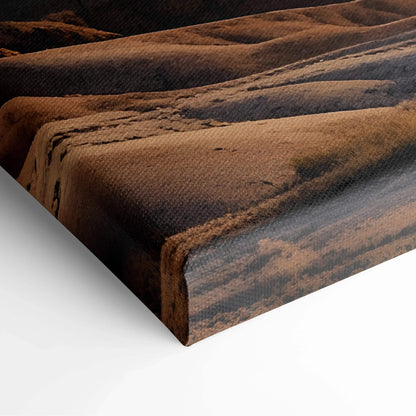 Close-up of textured canvas wall art featuring warm-toned mountain sunset digital art print.