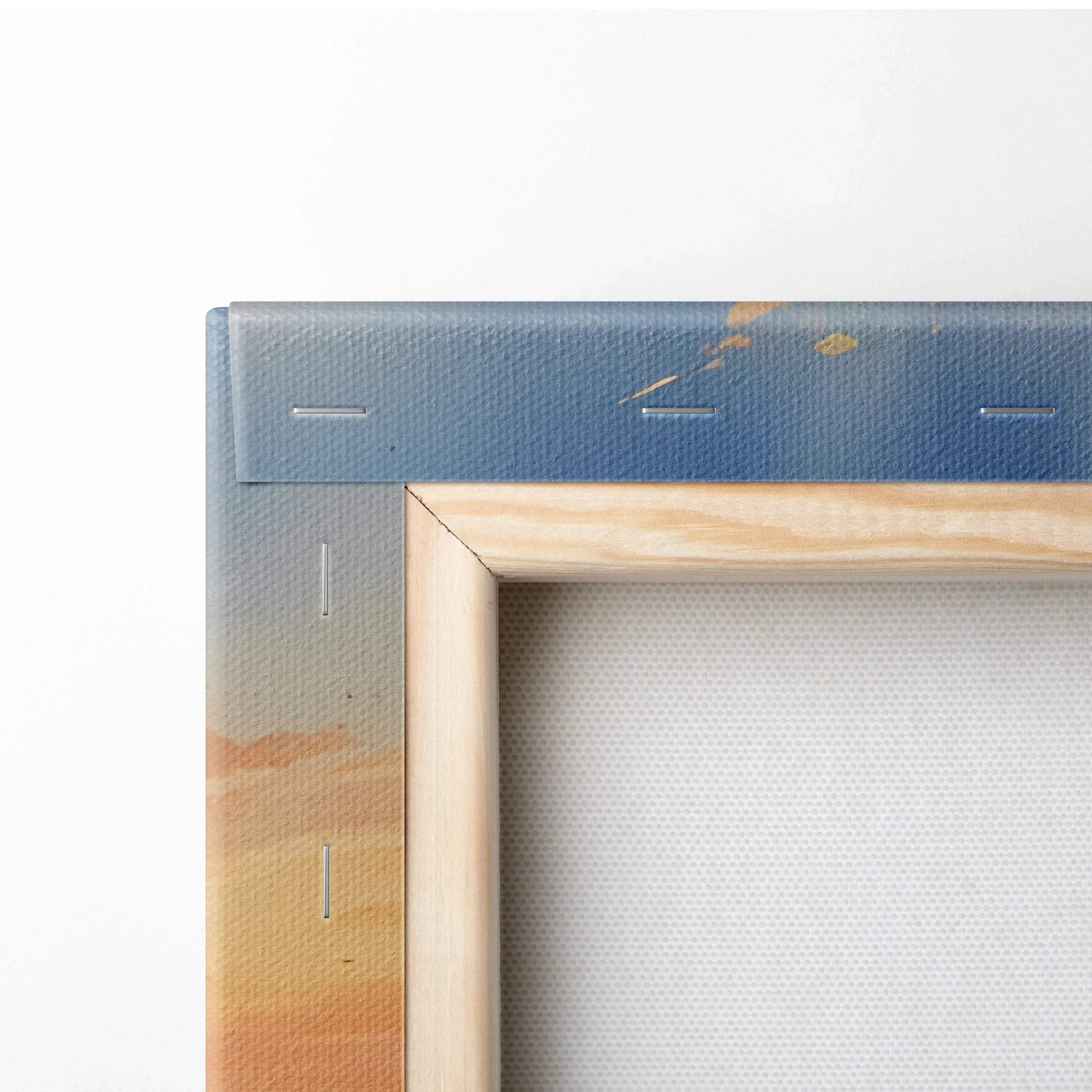 Close-up of stretched canvas wall art corner with wooden frame and sunset floral design on fabric.
