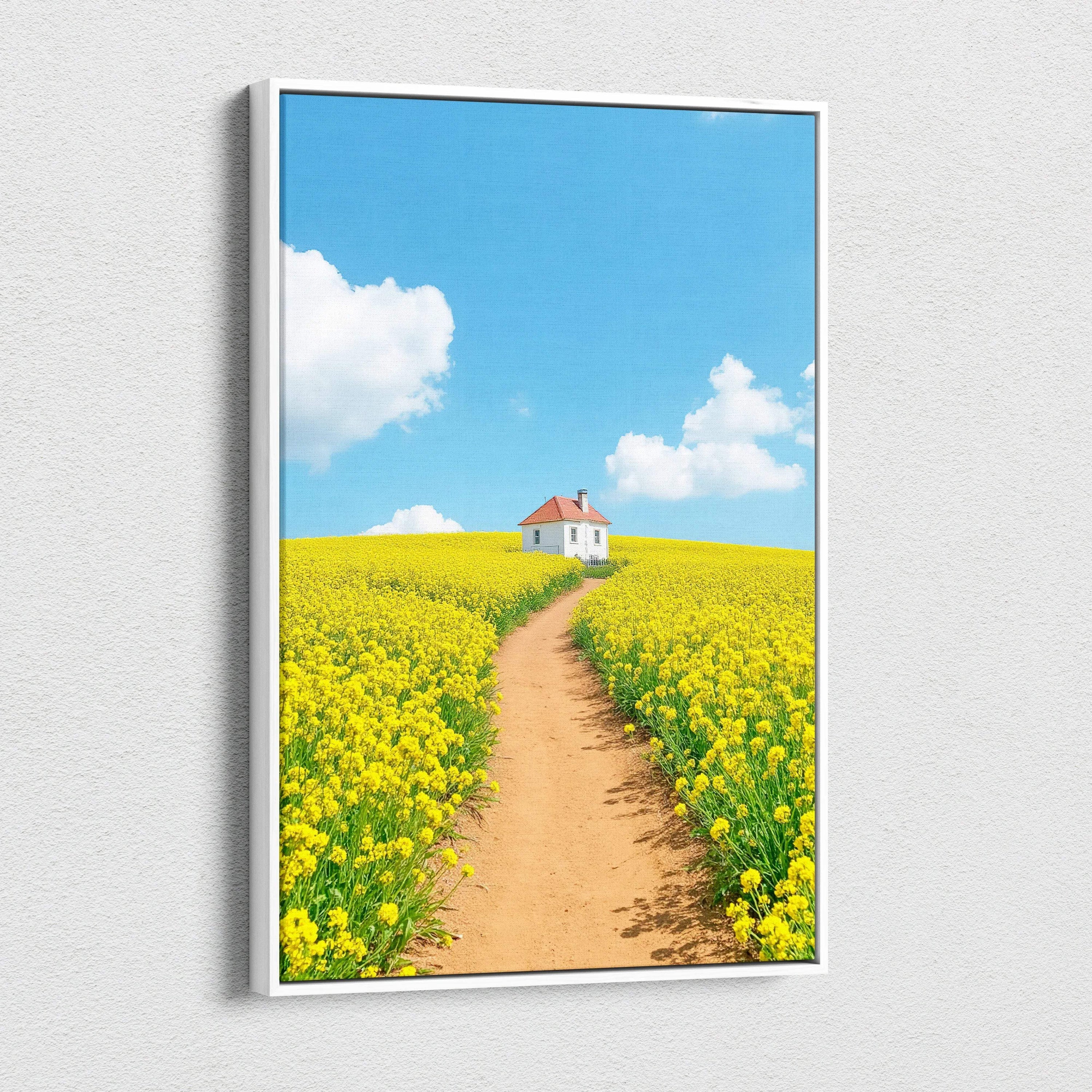 Canvas wall art featuring a dirt path through a yellow flower field leading to a small white house under a bright blue sky.