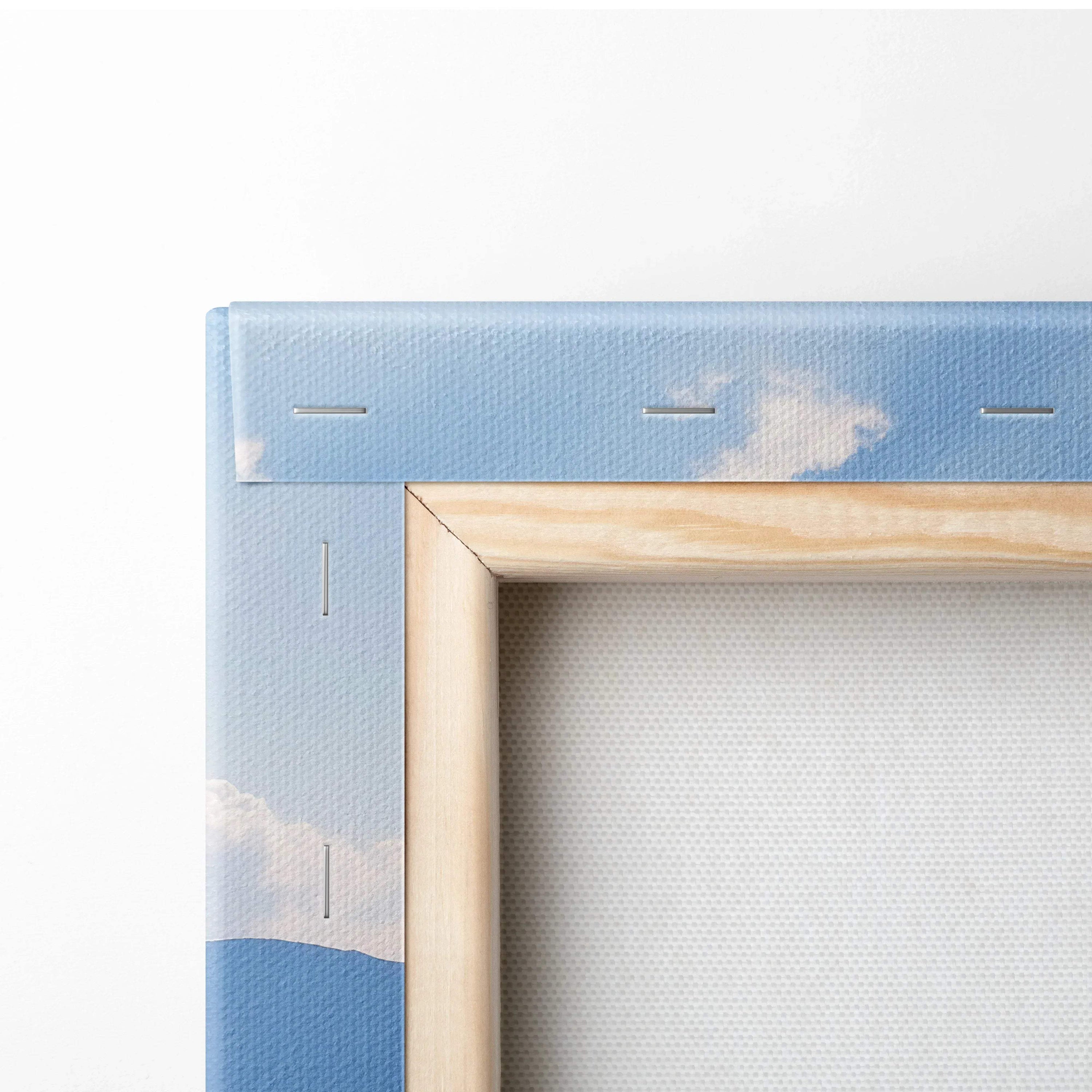 Close-up of corner showing stretched canvas with wooden frame and vibrant floral mountains wall art print.