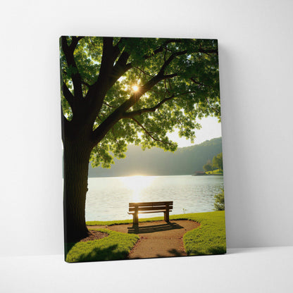 Canvas wall art featuring a sunlit tree and bench by a lakeside with mountains in the background.