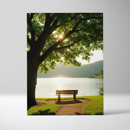 Canvas wall art featuring a serene lakeside scene with a bench under a large tree at sunset.