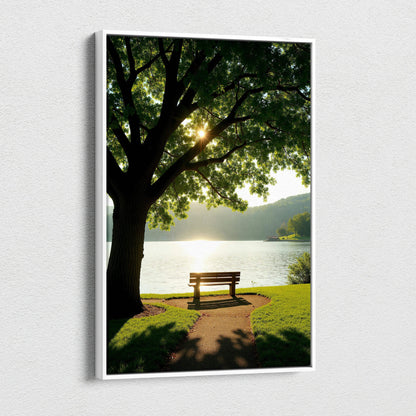 Canvas wall art of a serene lakeside bench under a large leafy tree with sunlight filtering through the branches.
